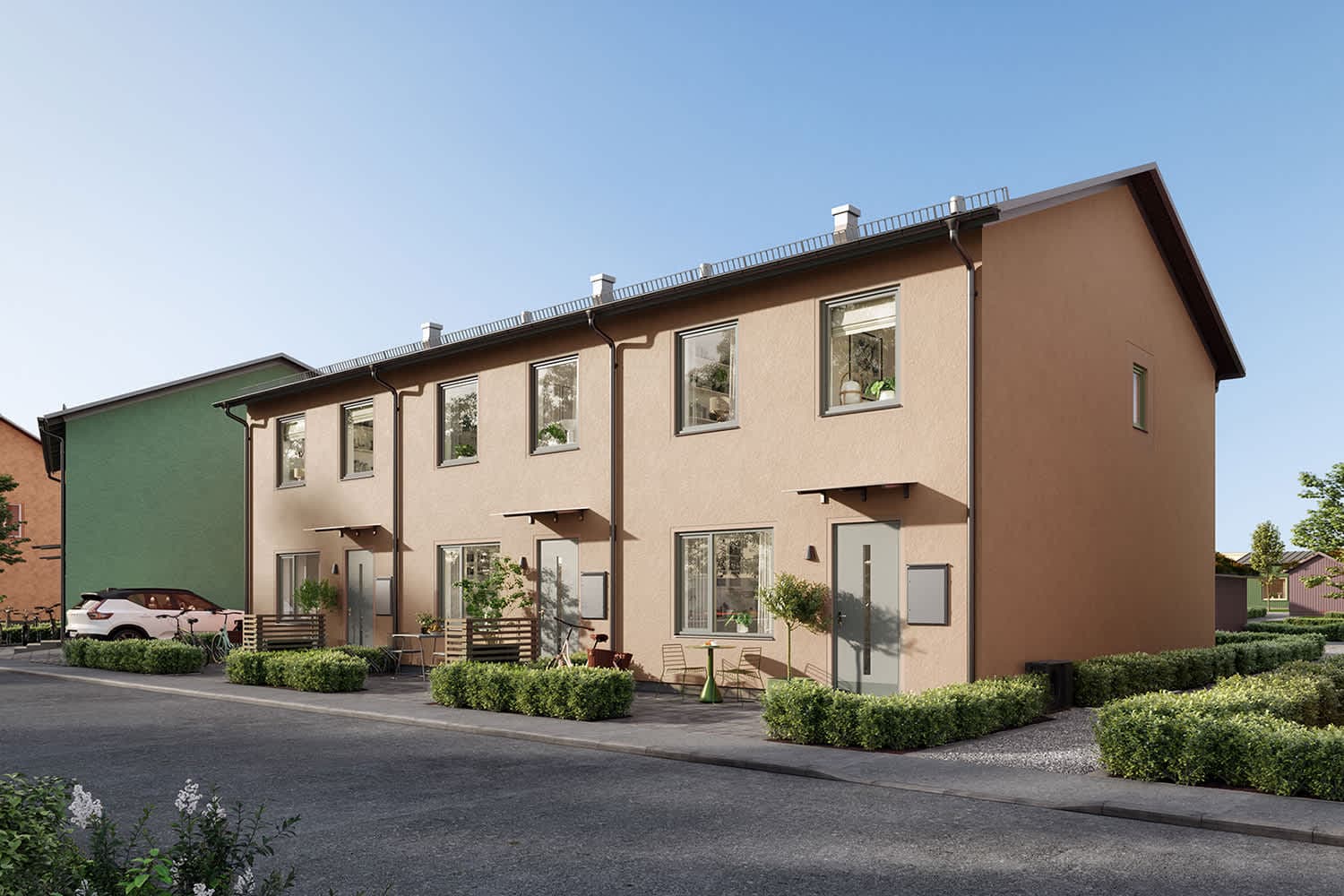 Illustration av radhuslänga med beige putsfasad