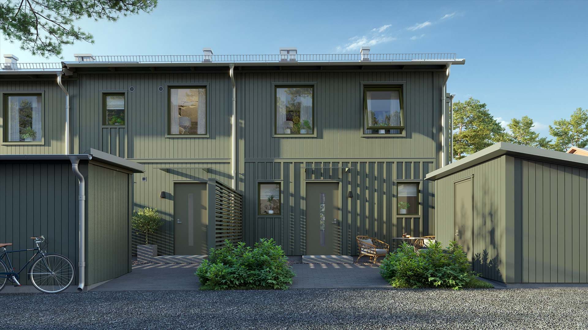 Framsida från gröna radhus i Älvdansen Wendelstrand